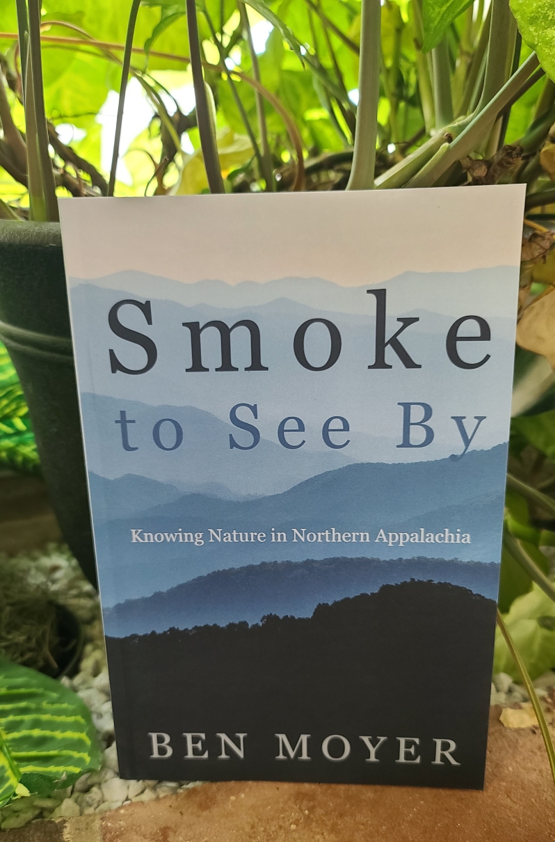Product Description: The January 2024 PPFF Virtual Book Club Selection of the Month</br></br>Smoke to See Byis a collection of 21 essays and stories written by award-winning essayist and columnist Ben Moyer. The collection tracks the writer’s quest for intimate knowledge of, and personal connection to, the natural features of his home region, the foothills and ridges of Northern Appalachia. Readers will follow Moyer along mountain streams and through native woodlands to insightful encounters with rare salamanders, wild trout, rattlesnakes, bears, songbirds, and bobcats, through a hurricane that turned to a blizzard, and working with troubled adolescents in a therapeutic camping program. In this selection of works, ranging from lengthy to one succinct page, Moyer reveals the meaning, and connection to place, he finds in butchering a deer in a freezing garage or in gathering blackberries amid summer’s heat. He also laments the loss of some familiar parts of the living landscape, unnoticed by many, as the region’s ecology absorbs onslaughts from invasive species and responds subtly to climate in transition. But overall, Smoke to See By is a quietly joyous celebration of the ecological resilience and diversity of a region those without Moyer’s perception might categorize as “unspectacular,” yet which harbors its own marvelous natural wonders, offered to those who would know them up close.</br> Smoke to See By